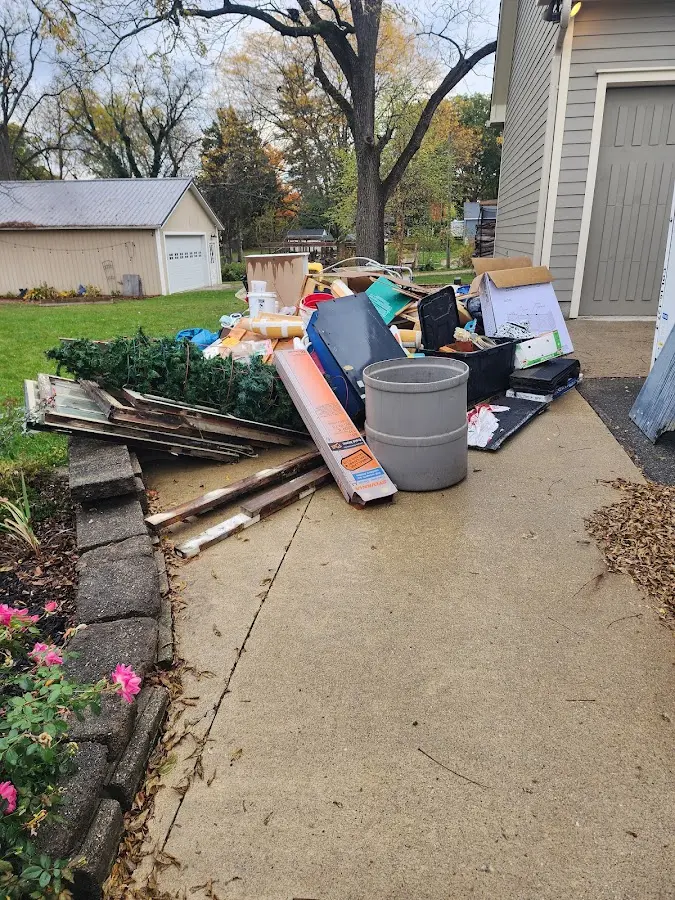 Dumpster being loaded with debris for Estate Cleanout Dumpster Rental in Aumsville